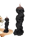 Dreifache Halloween-Kerze mit Skelettkopf. Hören Sie das Böse nicht. Sehen Sie das Böse nicht,...